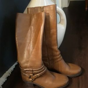 Brown Nine West high boots.